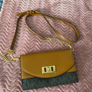 Michael Kors cross body wallet. Brown leather with black signature logo.